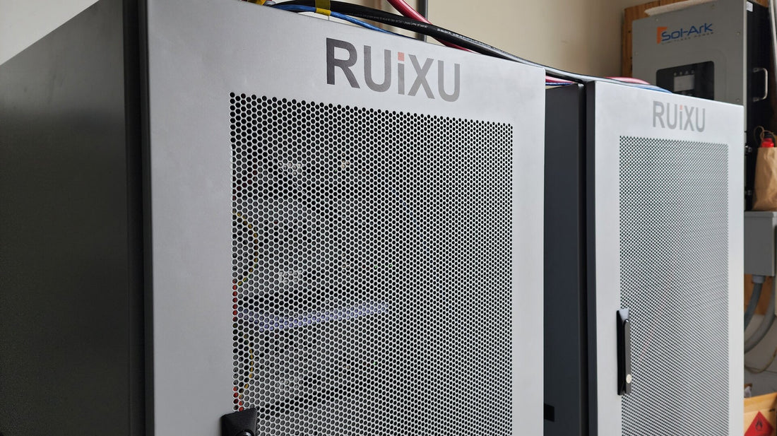 Two RUiXU server-rack battery cabinets in a real installed solar-storage system.