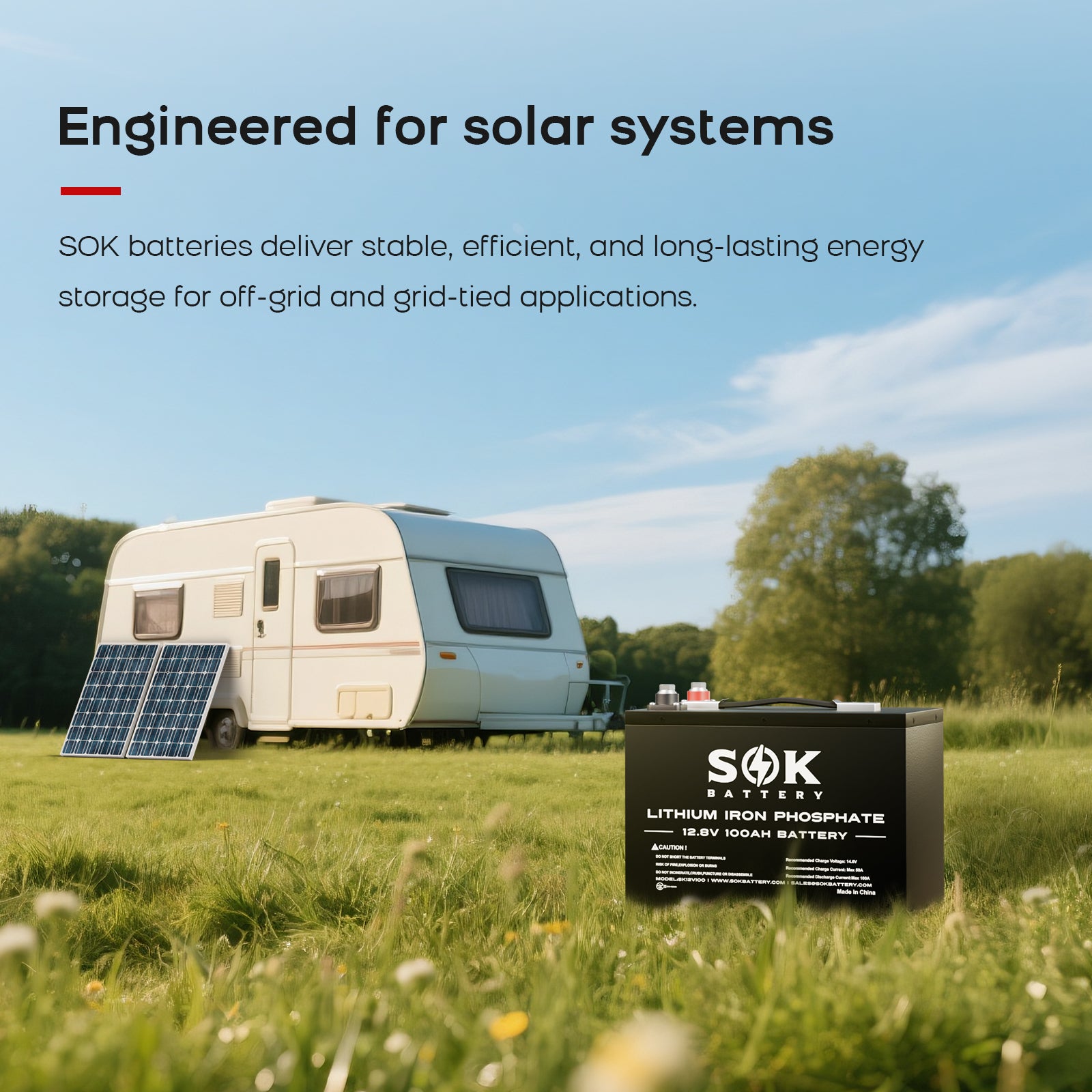 SOK SK12V100H battery shown beside solar panels and a travel trailer